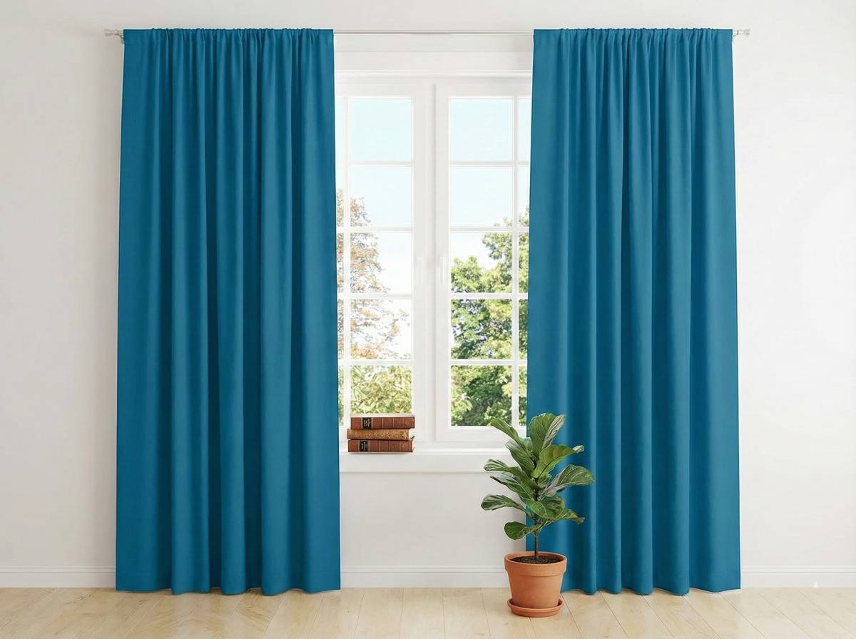 Light filtering solid sheer curtains installed in a bedroom