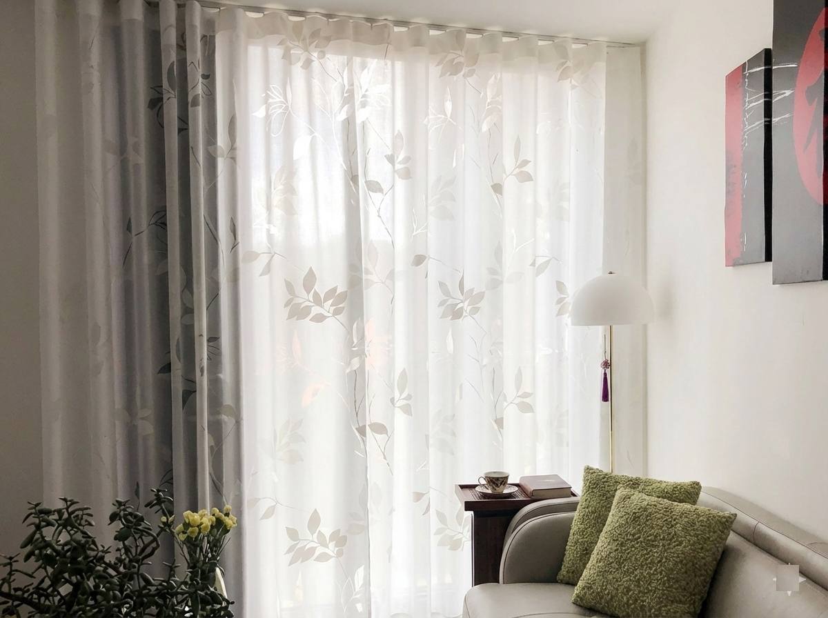 Patterned sheer curtains in a modern Bangalore living room