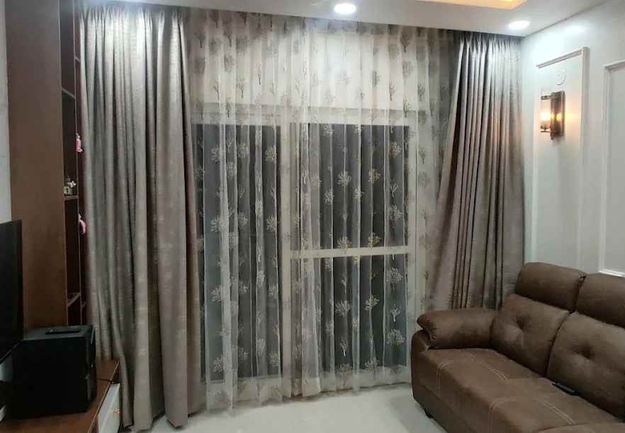 Living room with custom curtains installed in Bangalore home