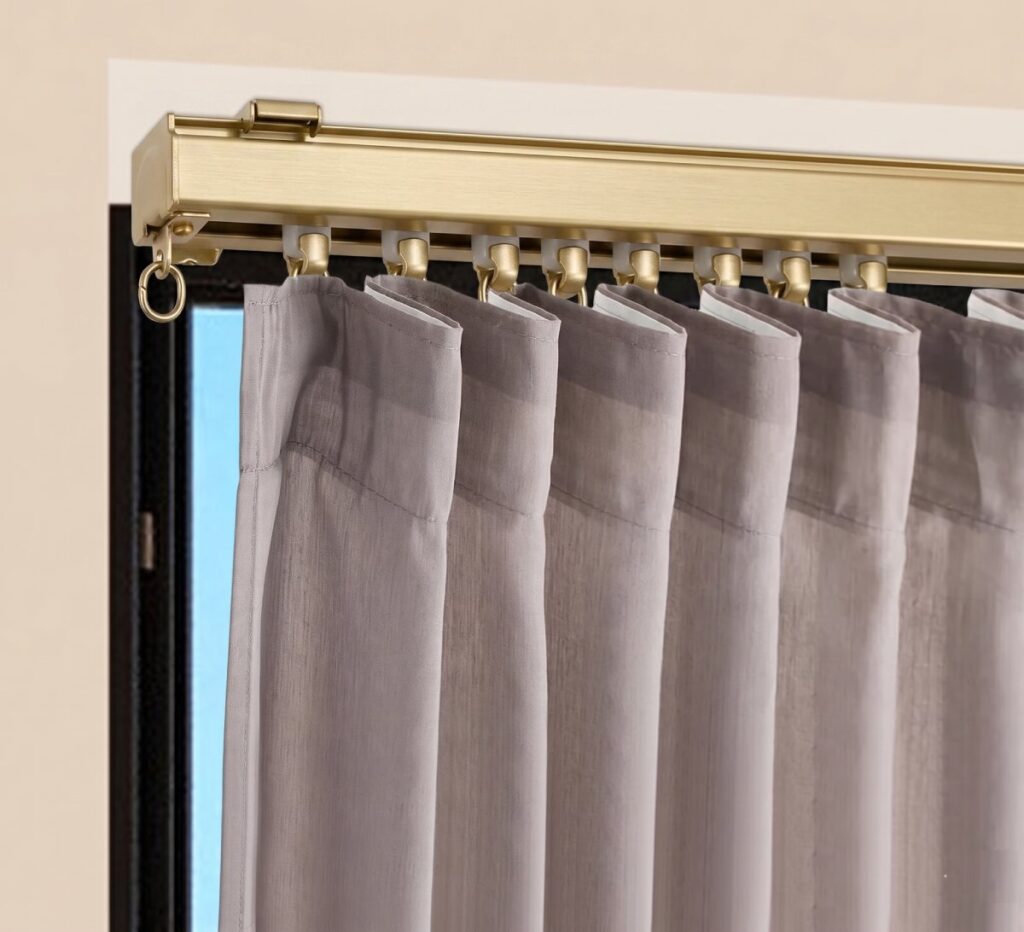 Ceiling mounted curtain track system in modern apartment